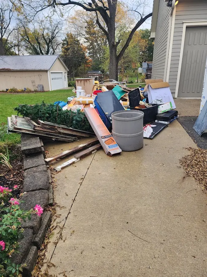 Dumpster being loaded with debris for 3 Yard Dumpster Rental in Walker Mill